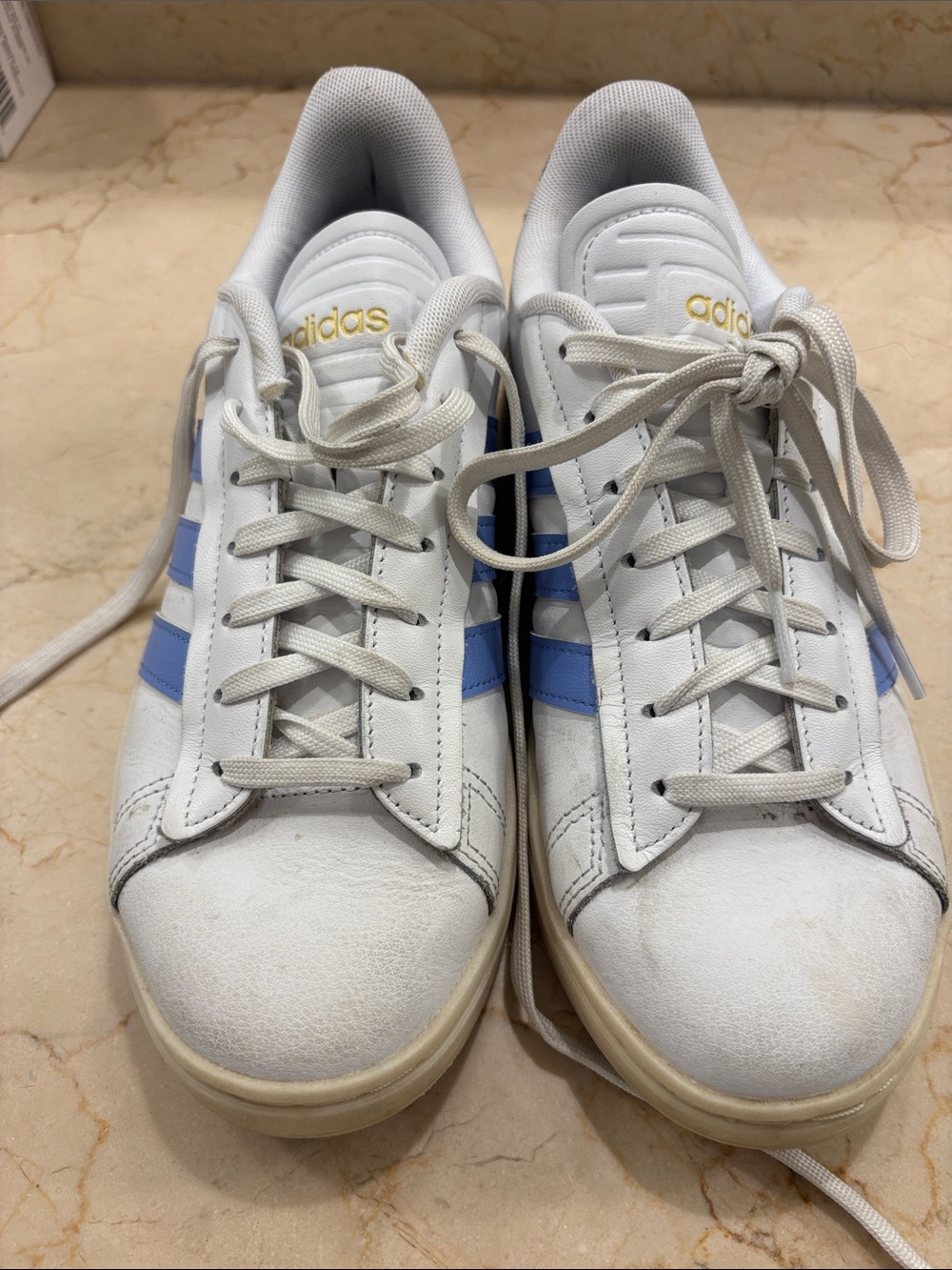 adidas White Sneakers with Light Blue Stripes and Gold Logos